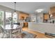 Eat-in kitchen with light-colored cabinets, stainless steel appliances, and hardwood floors at 9834 Belcrest Ln, Indianapolis, IN 46256