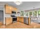Bright kitchen with stainless appliances, eat-in table and hardwood floors at 9834 Belcrest Ln, Indianapolis, IN 46256