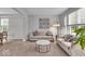 Bright and airy living room with neutral tones, plush sofas, and a cozy atmosphere at 9834 Belcrest Ln, Indianapolis, IN 46256