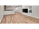 Spacious living room featuring wood floors, media center, and wet bar, perfect for entertaining at 9834 Belcrest Ln, Indianapolis, IN 46256