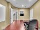 Office space with a view of another room and a large desk at 9834 Belcrest Ln, Indianapolis, IN 46256