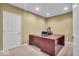 Bright office with a large desk and neutral colored walls at 9834 Belcrest Ln, Indianapolis, IN 46256
