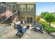 Charming patio with Adirondack chairs, ideal for relaxing outdoors around a fire pit at 9834 Belcrest Ln, Indianapolis, IN 46256