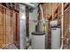 The utility room is equipped with updated water and heating systems, ensuring efficiency at 9834 Belcrest Ln, Indianapolis, IN 46256