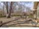Cozy brick patio with outdoor seating, perfect for entertaining or relaxing in the serene backyard at 10130 Central Ave, Carmel, IN 46280