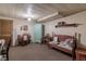 Cozy basement space with vintage furniture, desk, and ample storage, offering a comfortable and functional area at 10130 Central Ave, Carmel, IN 46280