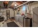 Basement laundry area features a washer, dryer, and utility sink at 10130 Central Ave, Carmel, IN 46280