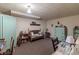 Relaxing basement area with vintage furniture, including a daybed, desk and ample storage for comfortable space at 10130 Central Ave, Carmel, IN 46280