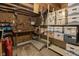 Unfinished basement with storage shelves and tools ready for workshop or additional space at 10130 Central Ave, Carmel, IN 46280