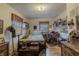 Inviting bedroom with natural light, classic furniture, and decorative shelves for a cozy, personal space at 10130 Central Ave, Carmel, IN 46280