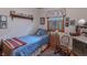 Cozy bedroom with a single bed, rocking chair, and window for a comfortable and inviting retreat at 10130 Central Ave, Carmel, IN 46280