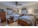 Bedroom with two beds, ceiling fan, and charming decor, creating a comfortable and inviting space at 10130 Central Ave, Carmel, IN 46280
