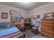 Cozy bedroom with a single bed, rocking chair, and rustic decor for a comfortable and inviting retreat at 10130 Central Ave, Carmel, IN 46280