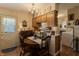 Cozy breakfast nook features a round table, chandelier, and access to the exterior at 10130 Central Ave, Carmel, IN 46280