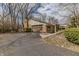Attached brick garage with multi-car parking, ample driveway space, and well-maintained landscaping at 10130 Central Ave, Carmel, IN 46280