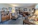 Comfortable living room with a piano, patterned armchairs, and a neutral color palette at 10130 Central Ave, Carmel, IN 46280