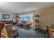 Inviting living room with a plush sofa, piano, and traditional furnishings, creating a cozy atmosphere at 10130 Central Ave, Carmel, IN 46280