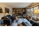 Bright living room features a brick fireplace, built-in shelving, and a large bay window at 10130 Central Ave, Carmel, IN 46280