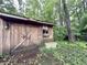 Backyard wooden shed with ample space for storage, surrounded by greenery at 10130 Central Ave, Carmel, IN 46280