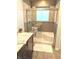 Bathroom with a glass-enclosed shower, tiled walls, and a vanity with modern fixtures at 10421 Sand Creek Blvd, Fishers, IN 46037