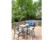 Outdoor deck features a dining table, chairs, and cushioned sofa for relaxing and entertaining at 10421 Sand Creek Blvd, Fishers, IN 46037