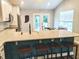 Modern kitchen with white cabinets, stainless steel appliances, and a large island with seating at 10421 Sand Creek Blvd, Fishers, IN 46037