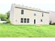 A large backyard with a view of the back of a two-story home at 10501 Morning Song Dr, Fishers, IN 46038