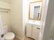 Cozy half bathroom with a modern vanity and a stylish gold-framed mirror at 10501 Morning Song Dr, Fishers, IN 46038