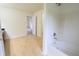 Bathroom featuring a tub/shower combo and access to the bedroom and closet at 10501 Morning Song Dr, Fishers, IN 46038
