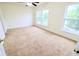Bright carpeted bedroom with large windows providing natural light at 10501 Morning Song Dr, Fishers, IN 46038