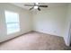 Comfortable bedroom with carpet floors and large window for natural light at 10501 Morning Song Dr, Fishers, IN 46038