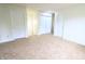 Neutral bedroom with carpet floors and 3 white doors leading to other rooms at 10501 Morning Song Dr, Fishers, IN 46038