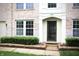 A two-story brick home featuring a well-maintained lawn and an inviting front entrance at 10501 Morning Song Dr, Fishers, IN 46038