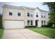 Charming two-story brick home with a well-manicured lawn and a two-car garage at 10501 Morning Song Dr, Fishers, IN 46038