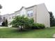 A two-story brick home with a well-kept lawn and mature landscaping at 10501 Morning Song Dr, Fishers, IN 46038