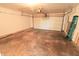 This is a two car garage featuring a white garage door and stained concrete at 10501 Morning Song Dr, Fishers, IN 46038