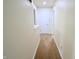 Well-lit hallway with carpet floors and doors leading to other rooms at 10501 Morning Song Dr, Fishers, IN 46038
