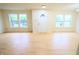 Bright living room featuring wood floors, neutral paint, and lots of natural light at 10501 Morning Song Dr, Fishers, IN 46038