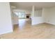 Bright living room with wood floors, white walls, fireplace, and an open floor plan at 10501 Morning Song Dr, Fishers, IN 46038
