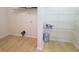 Bright storage room with shelving and hardwood floors at 10501 Morning Song Dr, Fishers, IN 46038