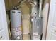 A water heater and a furnace for climate control in a small utility space at 10501 Morning Song Dr, Fishers, IN 46038