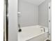A well-maintained bathroom featuring a large soaking tub and crisp white finishes at 10519 Hyacinth Ct, Noblesville, IN 46060