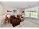 Comfortable sitting room with plush seating and a bright window to bring natural light indoors at 10519 Hyacinth Ct, Noblesville, IN 46060