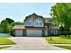 Charming two-story home with a three-car garage and a well-manicured lawn at 10519 Hyacinth Ct, Noblesville, IN 46060