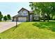 Beautifully landscaped front yard with lush green lawn and mature shade trees at 10519 Hyacinth Ct, Noblesville, IN 46060