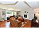 Comfortable living room featuring a fireplace, hardwood floors and ample seating at 10519 Hyacinth Ct, Noblesville, IN 46060