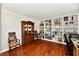 Home office area with hardwood floors and a built-in bookshelf perfect for any decor at 10519 Hyacinth Ct, Noblesville, IN 46060