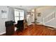 Brightly lit office area with hardwood floors and a view of the front yard at 10519 Hyacinth Ct, Noblesville, IN 46060
