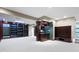 Basement area with custom shelving, kitchenette and neutral colored carpet at 11036 Ravenna Way, Indianapolis, IN 46236