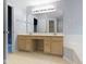 Bright bathroom with double vanity, tile floor and large mirror at 11036 Ravenna Way, Indianapolis, IN 46236